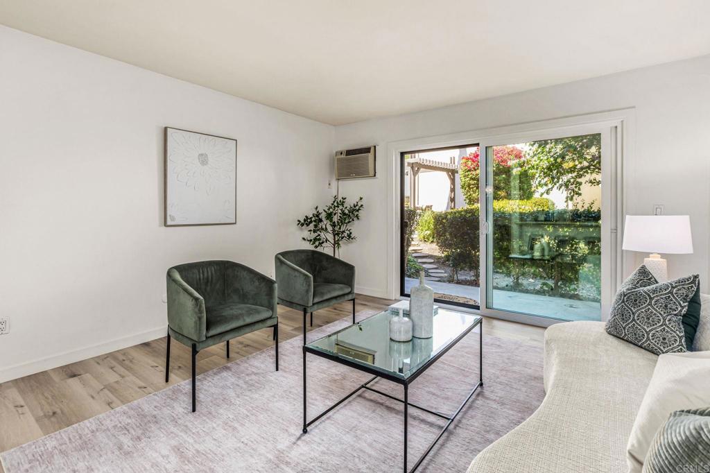 6780 Friars Road, Unit 129 San Diego, CA 92108 - Photo 3 of 50 a living room with furniture and a large window