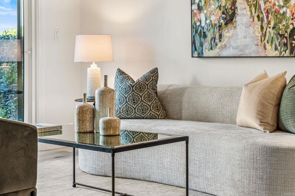 6780 Friars Road, Unit 129 San Diego, CA 92108 - Photo 4 of 50 a bedroom with a bed and painting on the wall