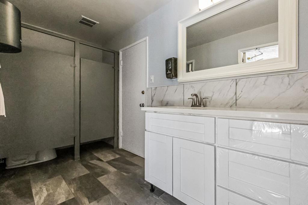 6780 Friars Road, Unit 129 San Diego, CA 92108 - Photo 44 of 50 a bathroom with a sink and a mirror