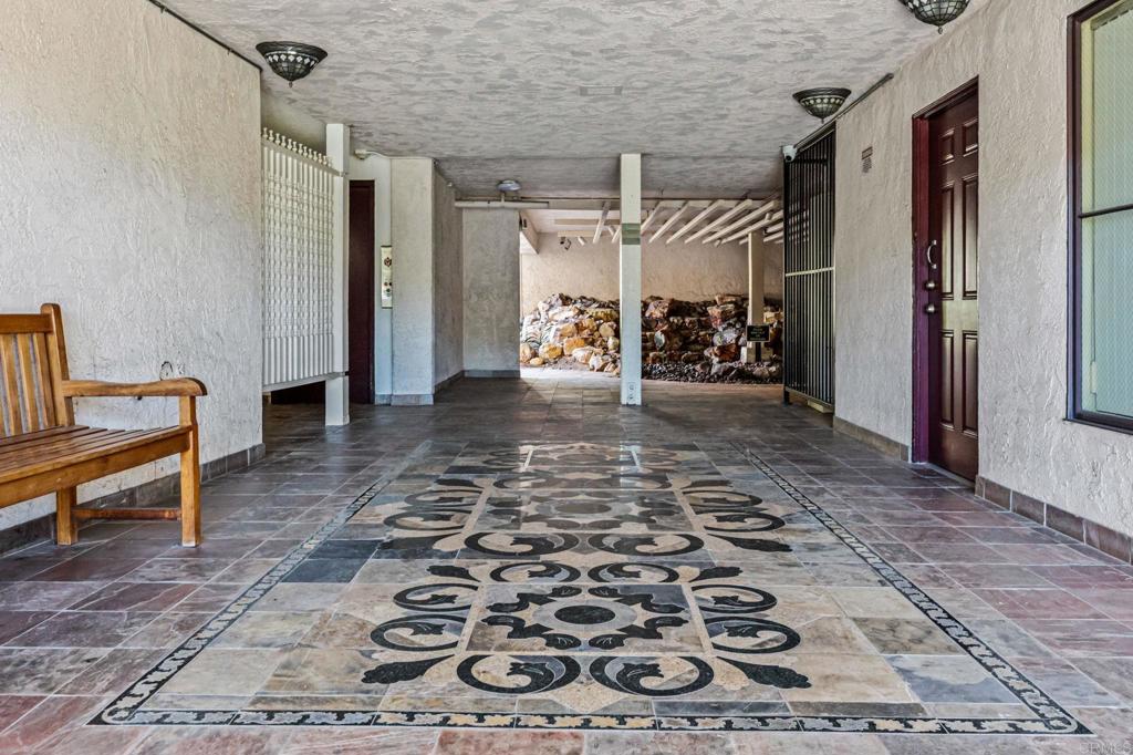 6780 Friars Road, Unit 129 San Diego, CA 92108 - Photo 47 of 50 a view of a hallway with a couch and an entryway