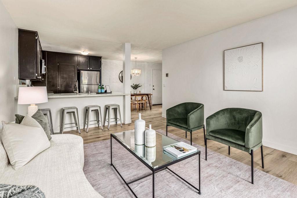 6780 Friars Road, Unit 129 San Diego, CA 92108 - Photo 5 of 50 a living room with furniture a rug and a flat screen tv