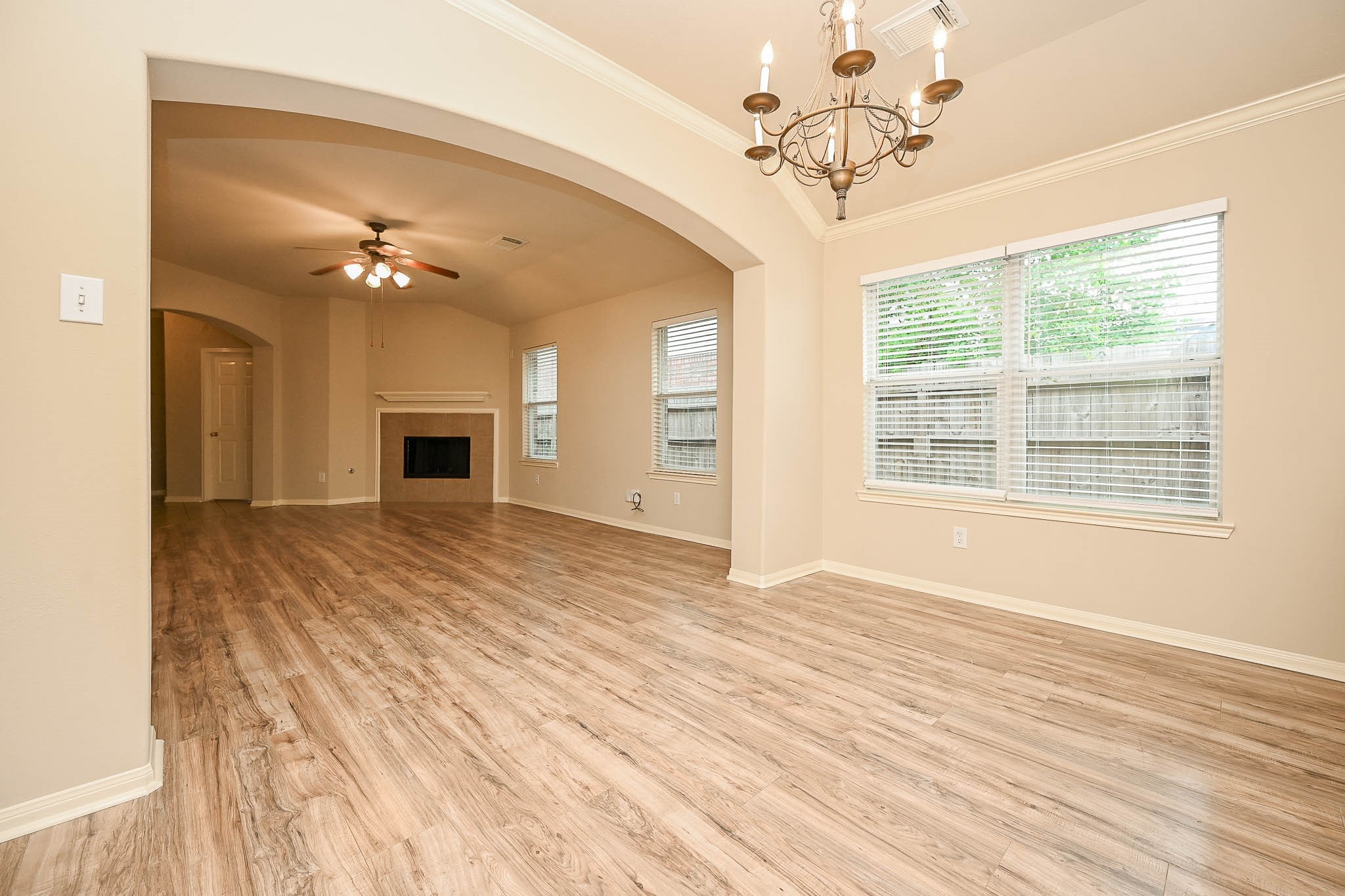 18518 Shadow Line Court Katy, TX 77449 - Photo 12 of 32 a view of an empty room with a window and a chandelier fan