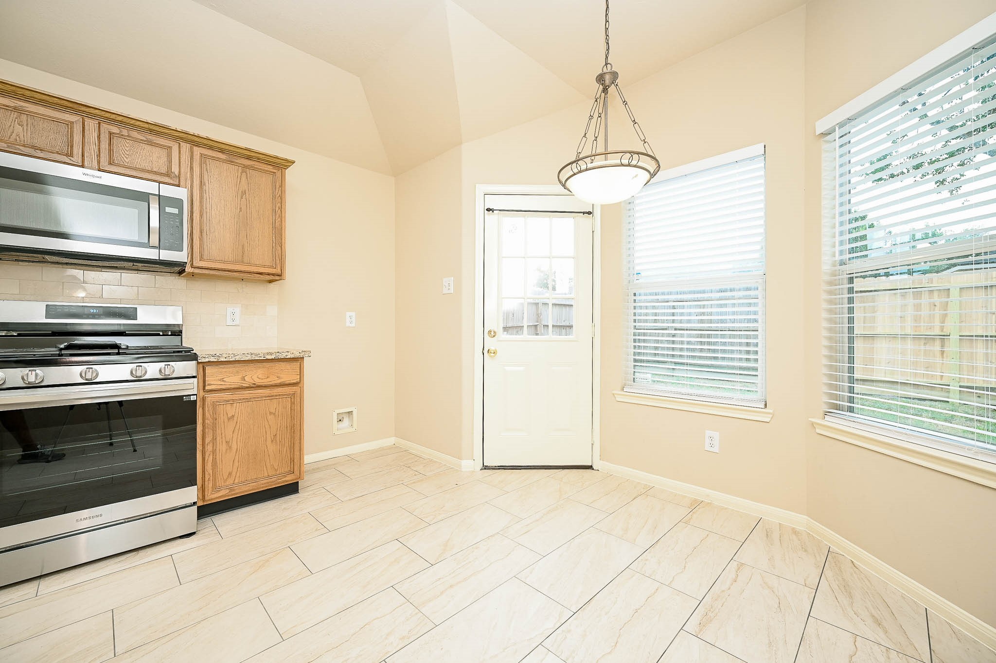 18518 Shadow Line Court Katy, TX 77449 - Photo 17 of 32 a kitchen with stainless steel appliances granite countertop a stove a sink and a microwave