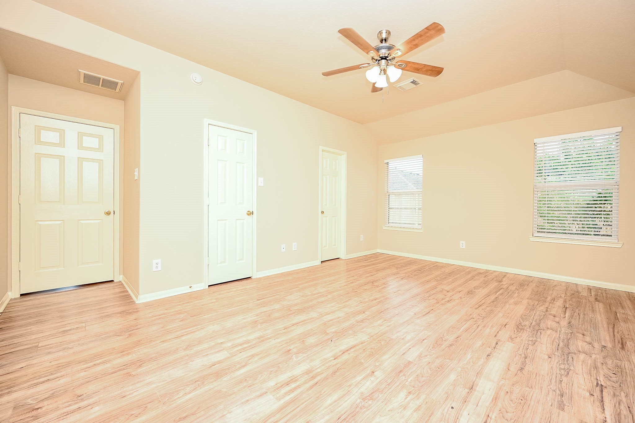 18518 Shadow Line Court Katy, TX 77449 - Photo 20 of 32 a view of an empty room with wooden floor and a ceiling fan