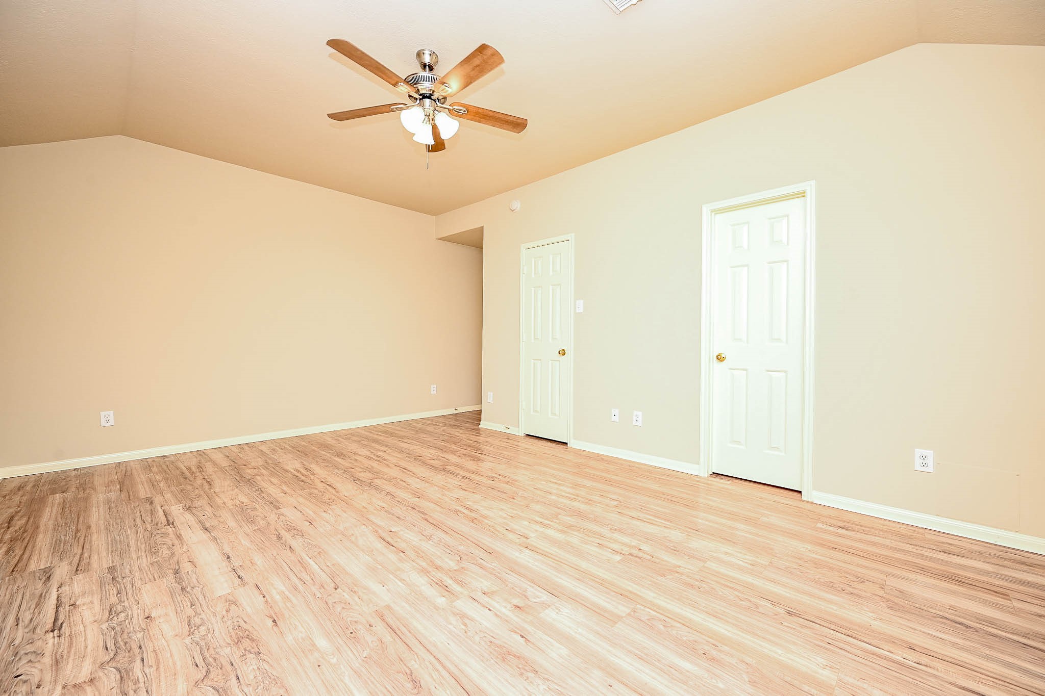 18518 Shadow Line Court Katy, TX 77449 - Photo 21 of 32 an empty room with wooden floor and a ceiling fan
