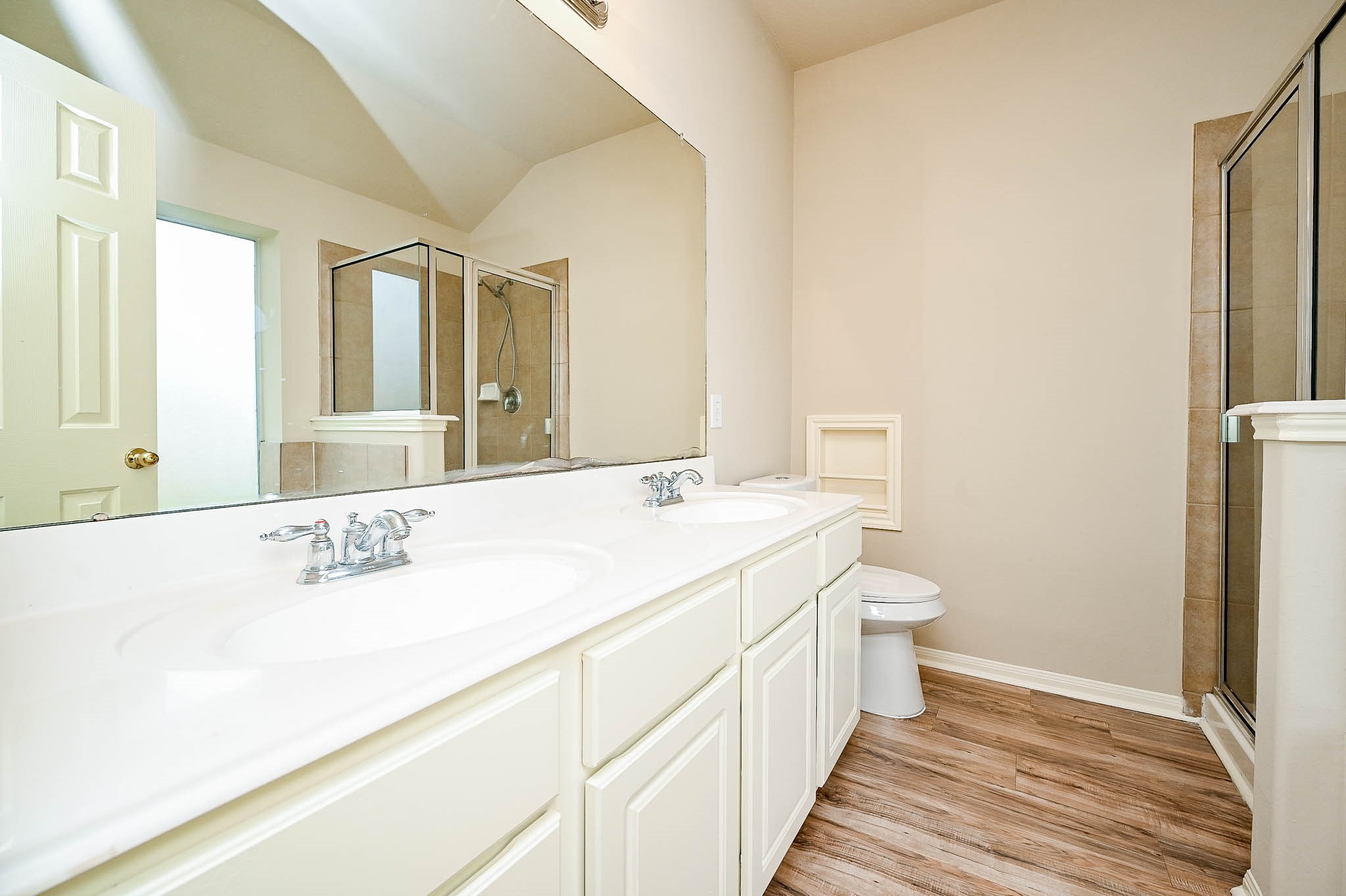 18518 Shadow Line Court Katy, TX 77449 - Photo 23 of 32 a spacious bathroom with a double vanity sink and mirror