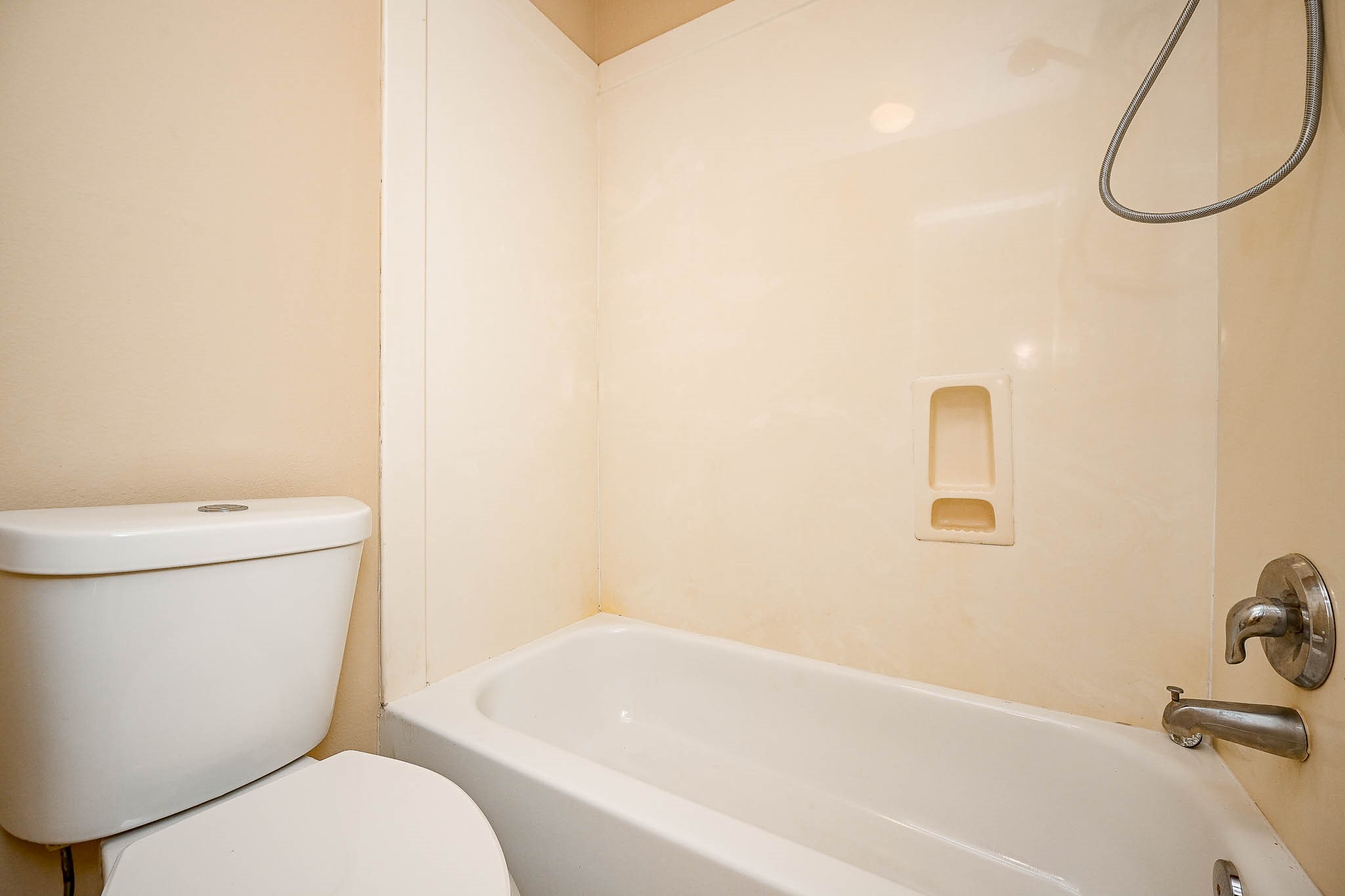 18518 Shadow Line Court Katy, TX 77449 - Photo 25 of 32 a white toilet sitting next to a bath tub