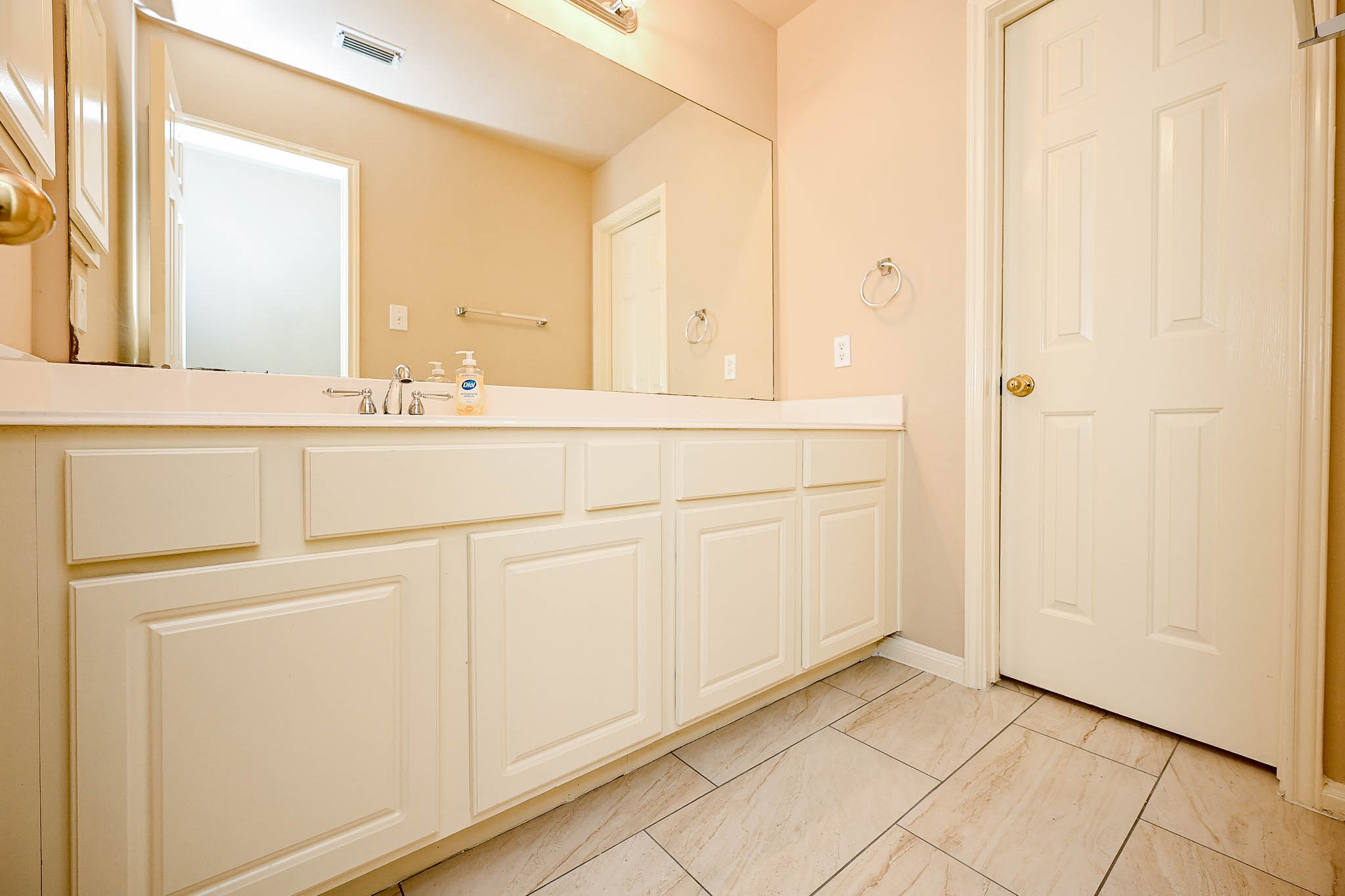 18518 Shadow Line Court Katy, TX 77449 - Photo 26 of 32 a bathroom with a sink and a mirror
