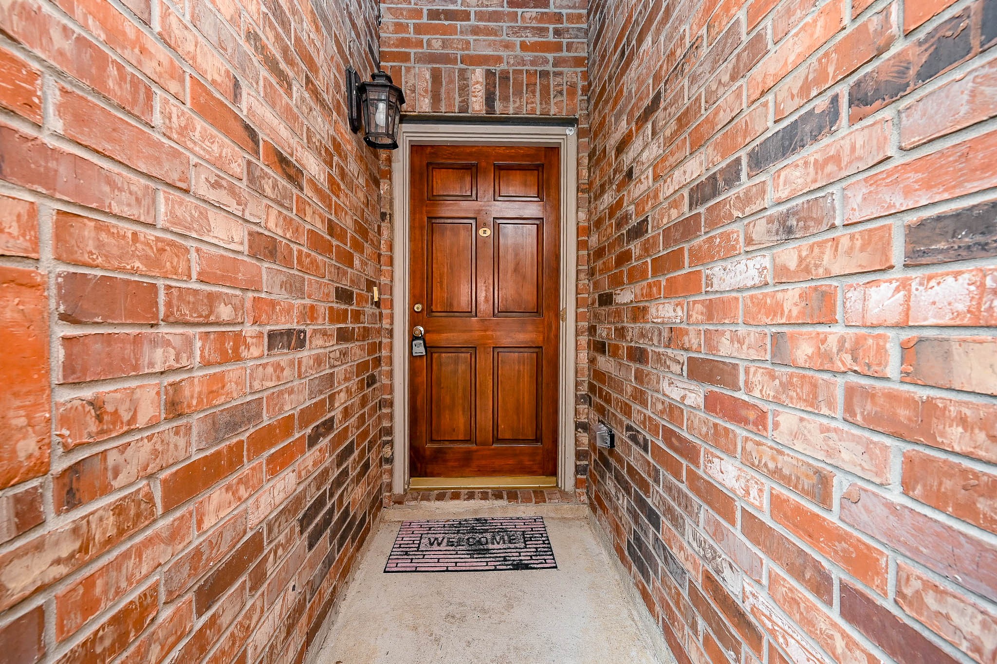 18518 Shadow Line Court Katy, TX 77449 - Photo 3 of 32 a view of a wooden door and brick wall