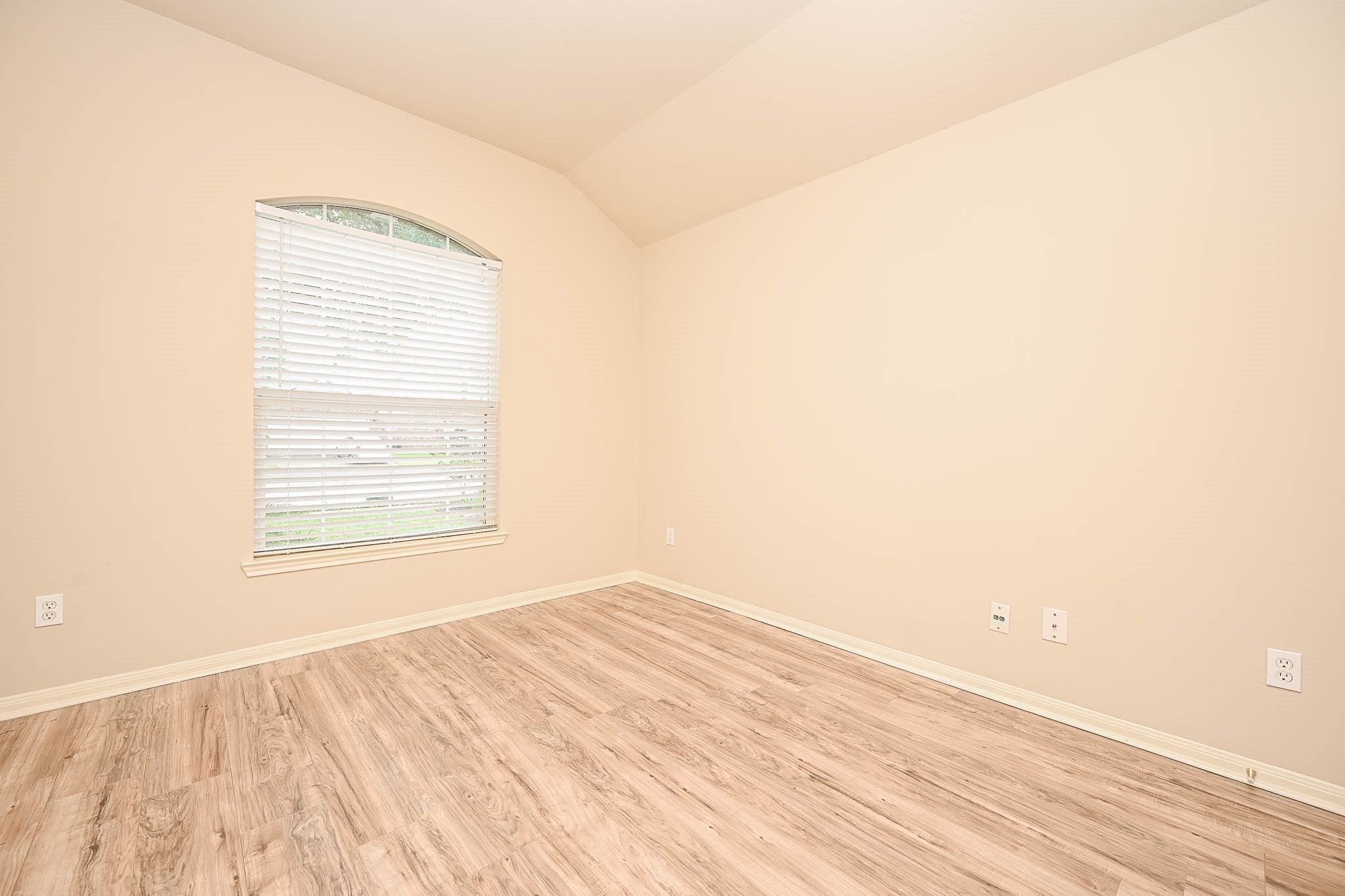 18518 Shadow Line Court Katy, TX 77449 - Photo 5 of 32 an empty room with wooden floor and windows