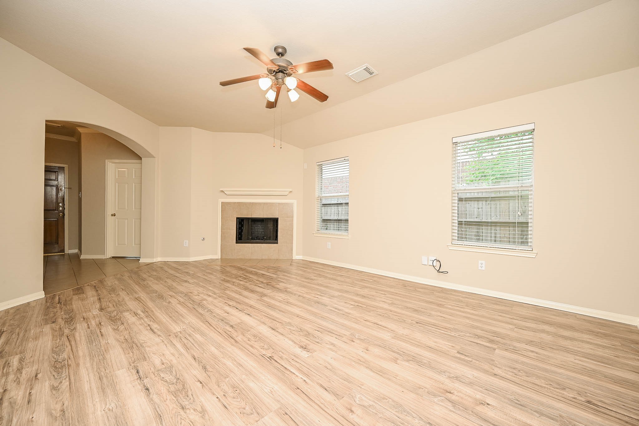 18518 Shadow Line Court Katy, TX 77449 - Photo 8 of 32 a view of an empty room with a fireplace and a window