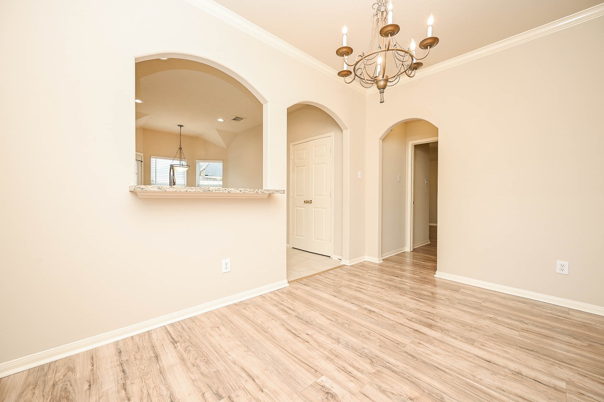 18518 Shadow Line Court Katy, TX 77449 - Photo 10 of 32 a view of a room with wooden floor and chandelier