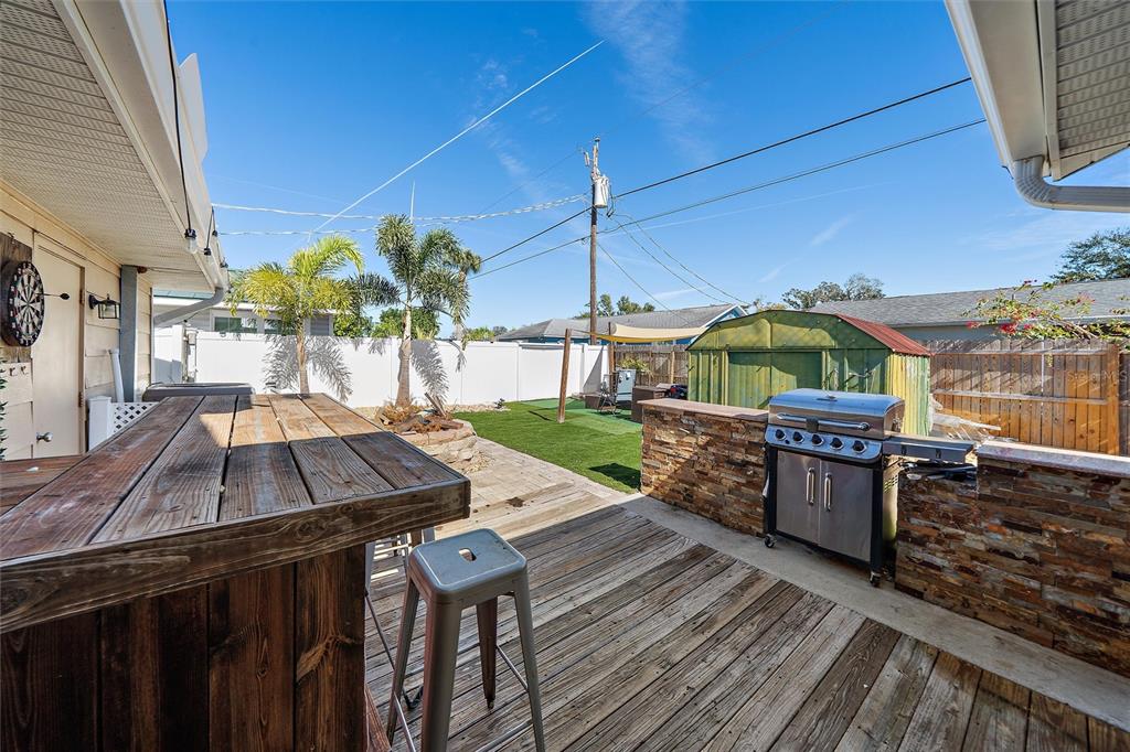 1056 Hope Street Venice, FL 34285 - Photo 13 of 27 a view of a rooftop deck with couch and chairs