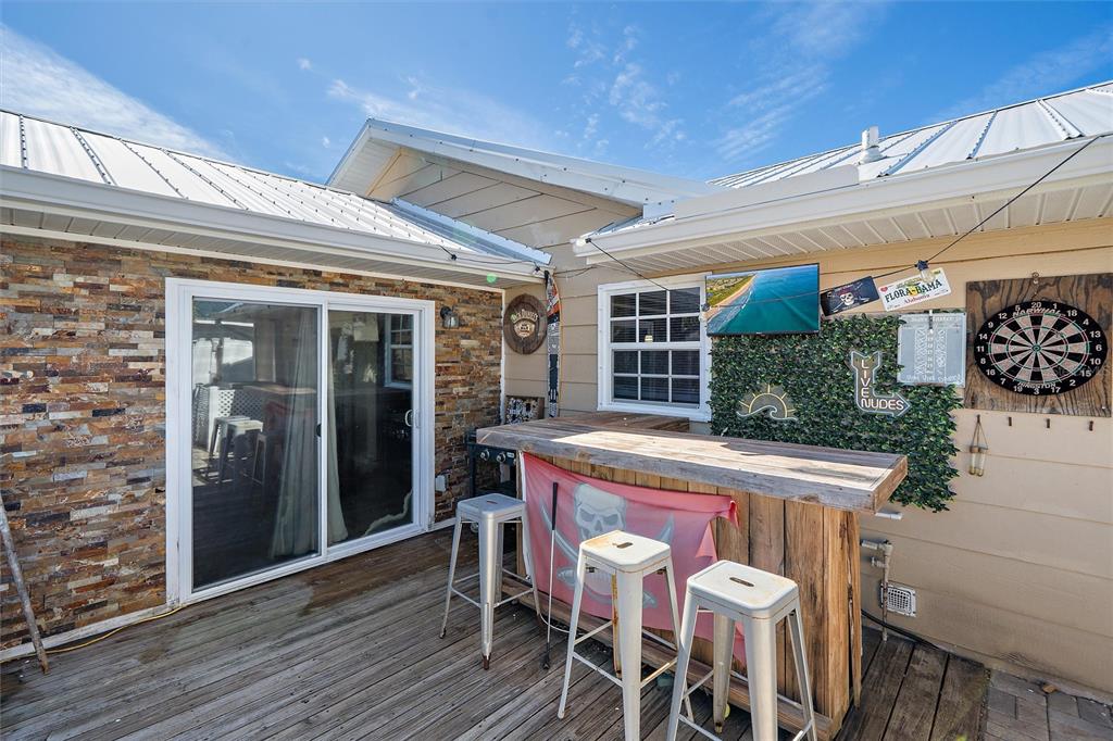 1056 Hope Street Venice, FL 34285 - Photo 14 of 27 a view of a table and chairs in patio of the house