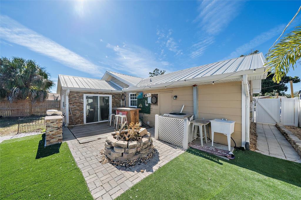 1056 Hope Street Venice, FL 34285 - Photo 15 of 27 a view of a house with a patio and a yard