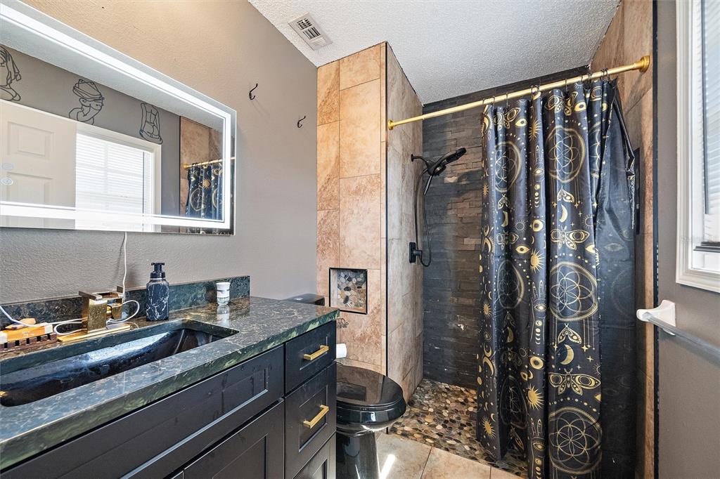 1056 Hope Street Venice, FL 34285 - Photo 17 of 27 a kitchen with a sink and cabinets