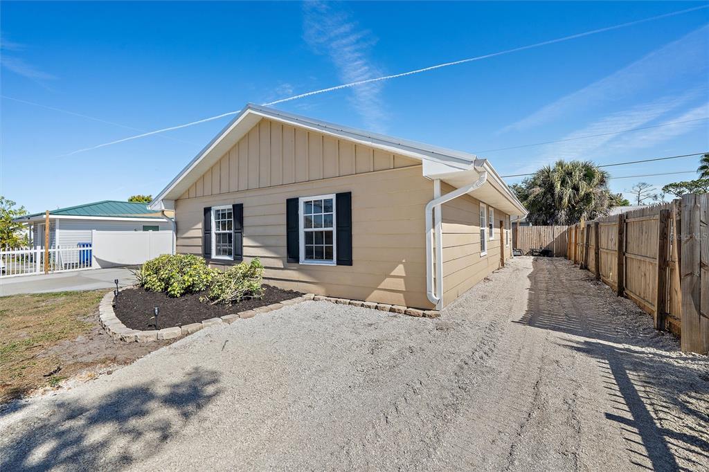 1056 Hope Street Venice, FL 34285 - Photo 23 of 27 a view of a house with wooden fence