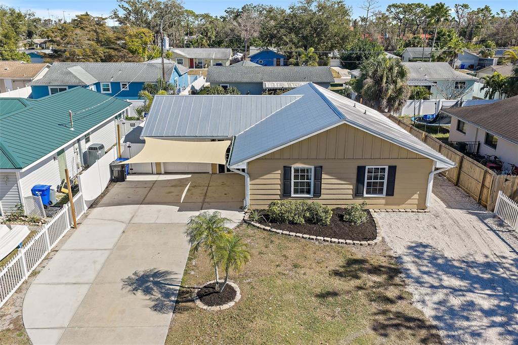 1056 Hope Street Venice, FL 34285 - Photo 24 of 27 a aerial view of a house with a yard and potted plants