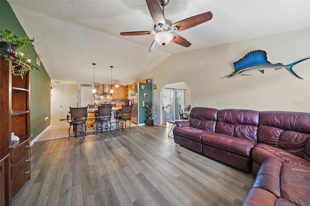 1056 Hope Street Venice, FL 34285 - Photo 10 of 27 a living room with furniture and wooden floor