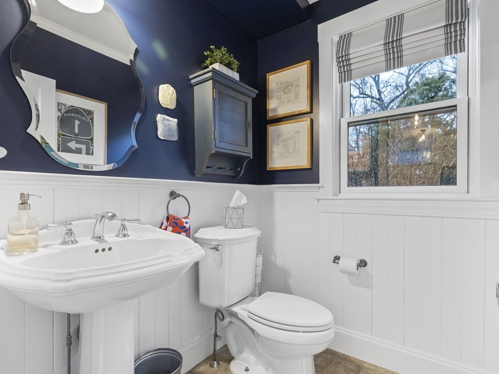 75 Curve Street Wellesley, MA 02482 - Photo 16 of 28 a bathroom with a sink mirror and toilet