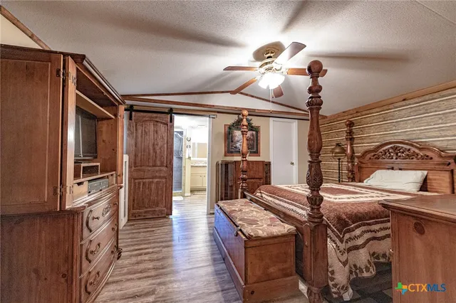 a kitchen with granite countertop a stove and a refrigerator