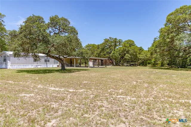 a house with swimming pool in front of it