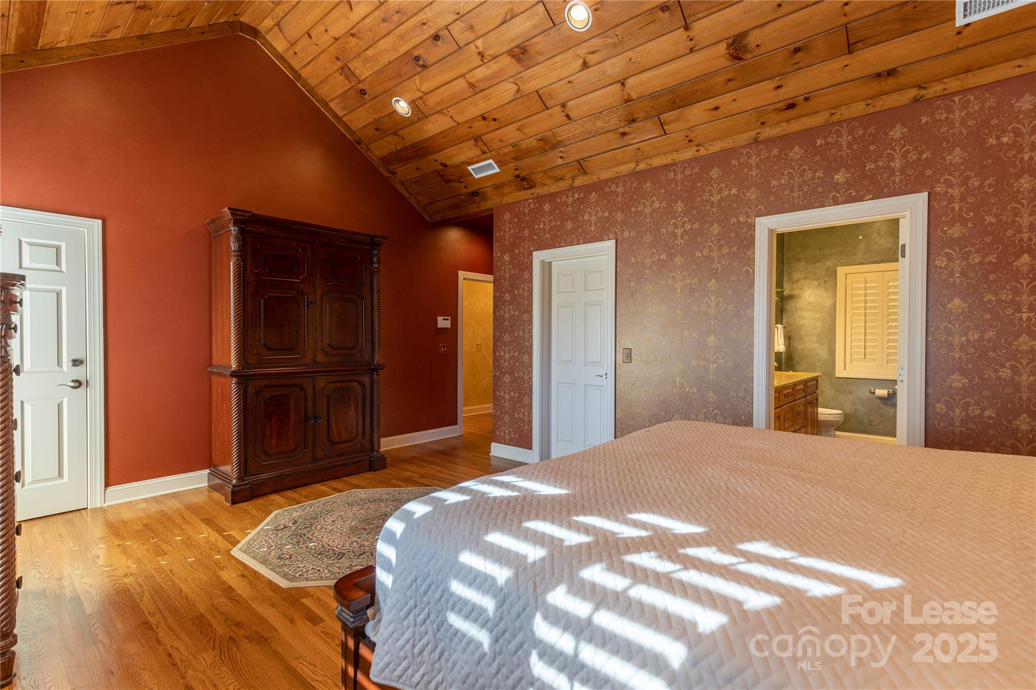 446 Windridge Drive Sugar Grove, NC 28679 - Photo 15 of 37 a bedroom with a bed and a large mirror