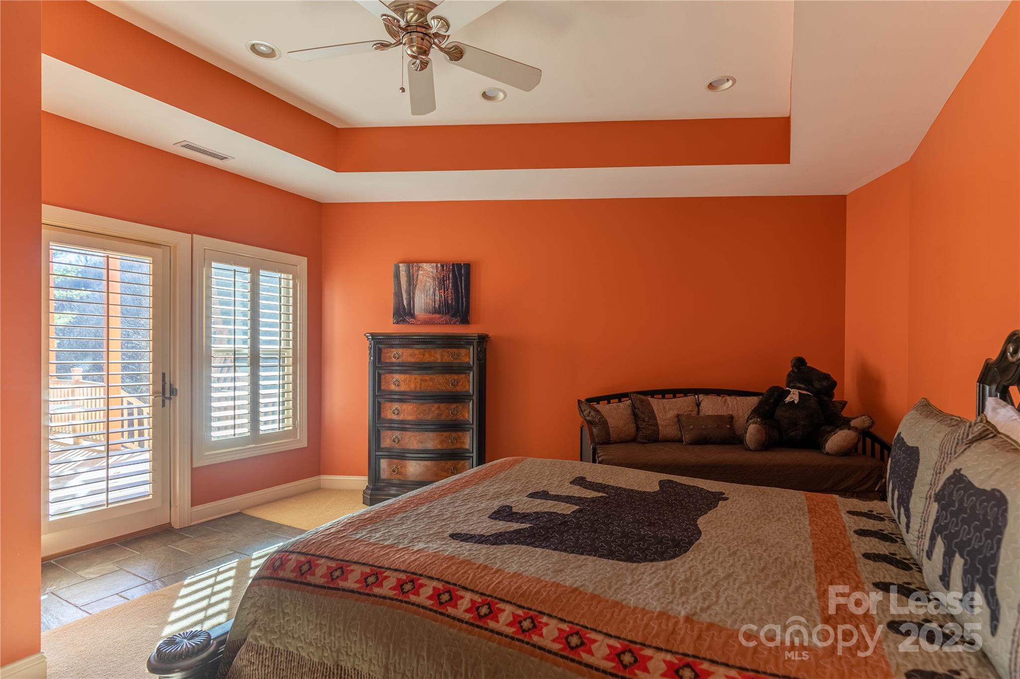 446 Windridge Drive Sugar Grove, NC 28679 - Photo 19 of 37 a bedroom with a bed and dresser with wooden floor
