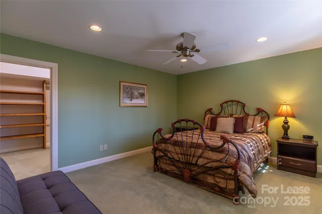 a bed room with a bed and a couch