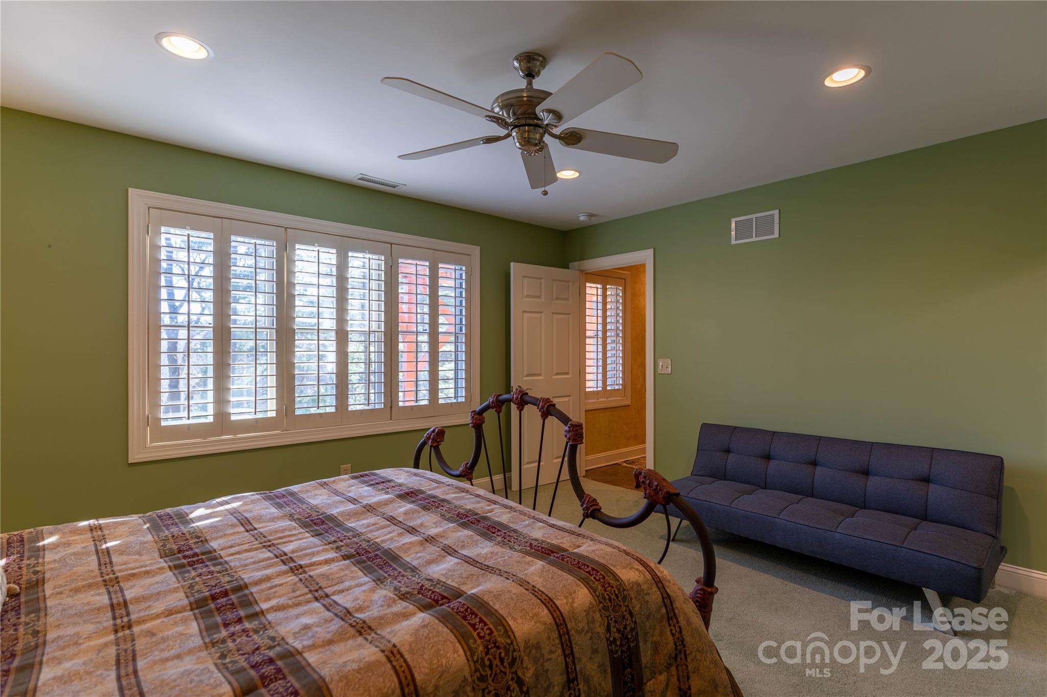 446 Windridge Drive Sugar Grove, NC 28679 - Photo 23 of 37 a bed room with a bed and a couch