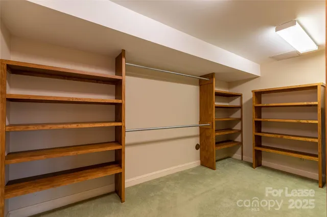 a room with furniture pool table and stairs