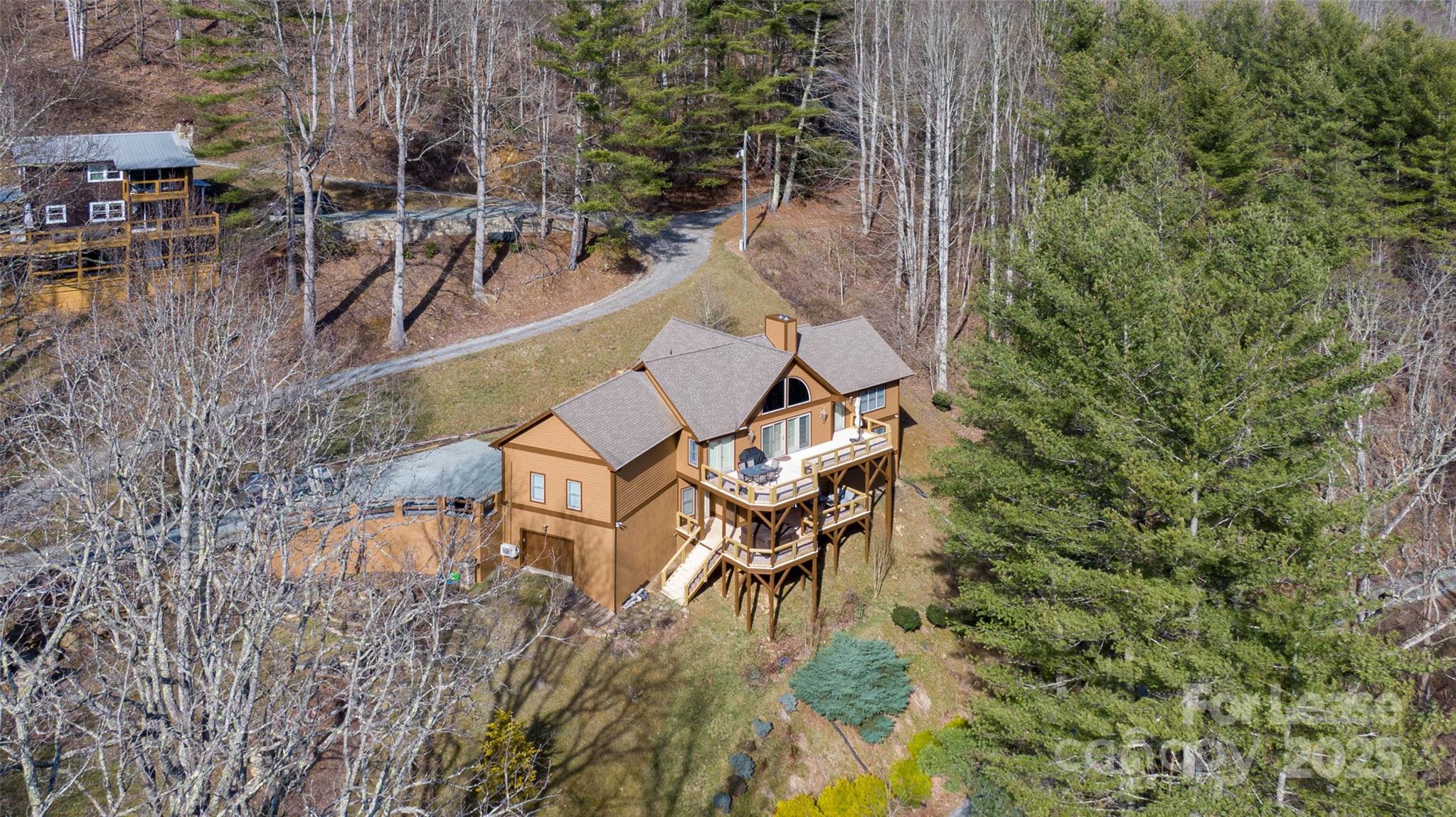 446 Windridge Drive Sugar Grove, NC 28679 - Photo 3 of 37 an aerial view of a house with swimming pool and sitting area