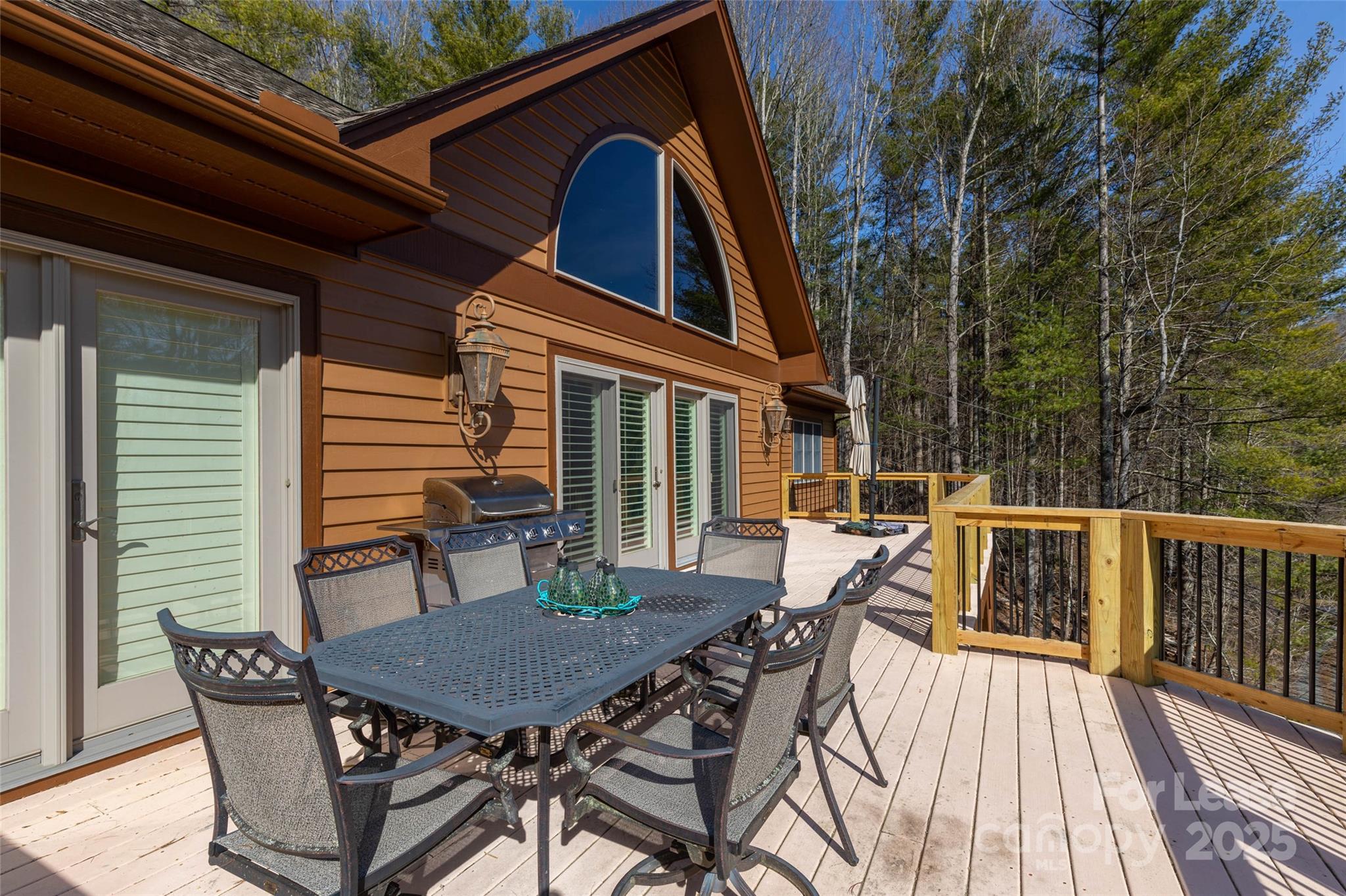 446 Windridge Drive Sugar Grove, NC 28679 - Photo 33 of 37 a balcony with wooden floor table and chairs