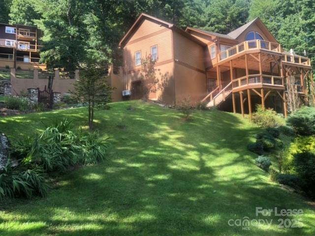 446 Windridge Drive Sugar Grove, NC 28679 - Photo 36 of 37 a front view of a house with garden