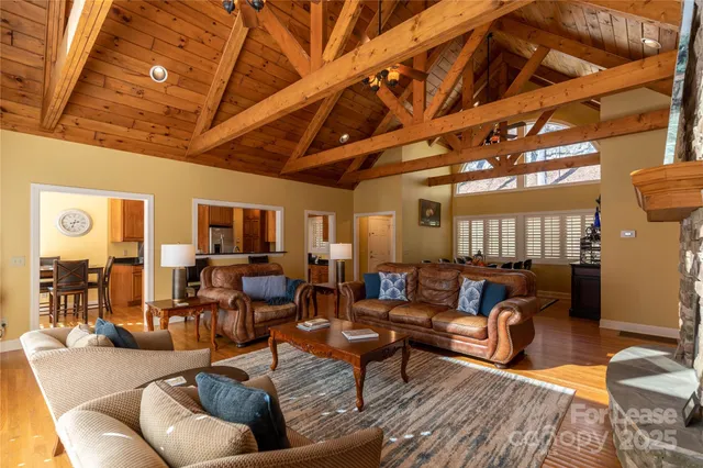 a living room with fireplace furniture and a flat screen tv