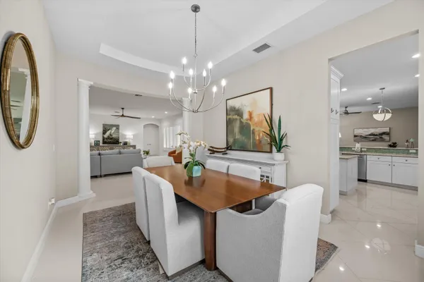 a view of a kitchen area kitchen island dining table and chairs