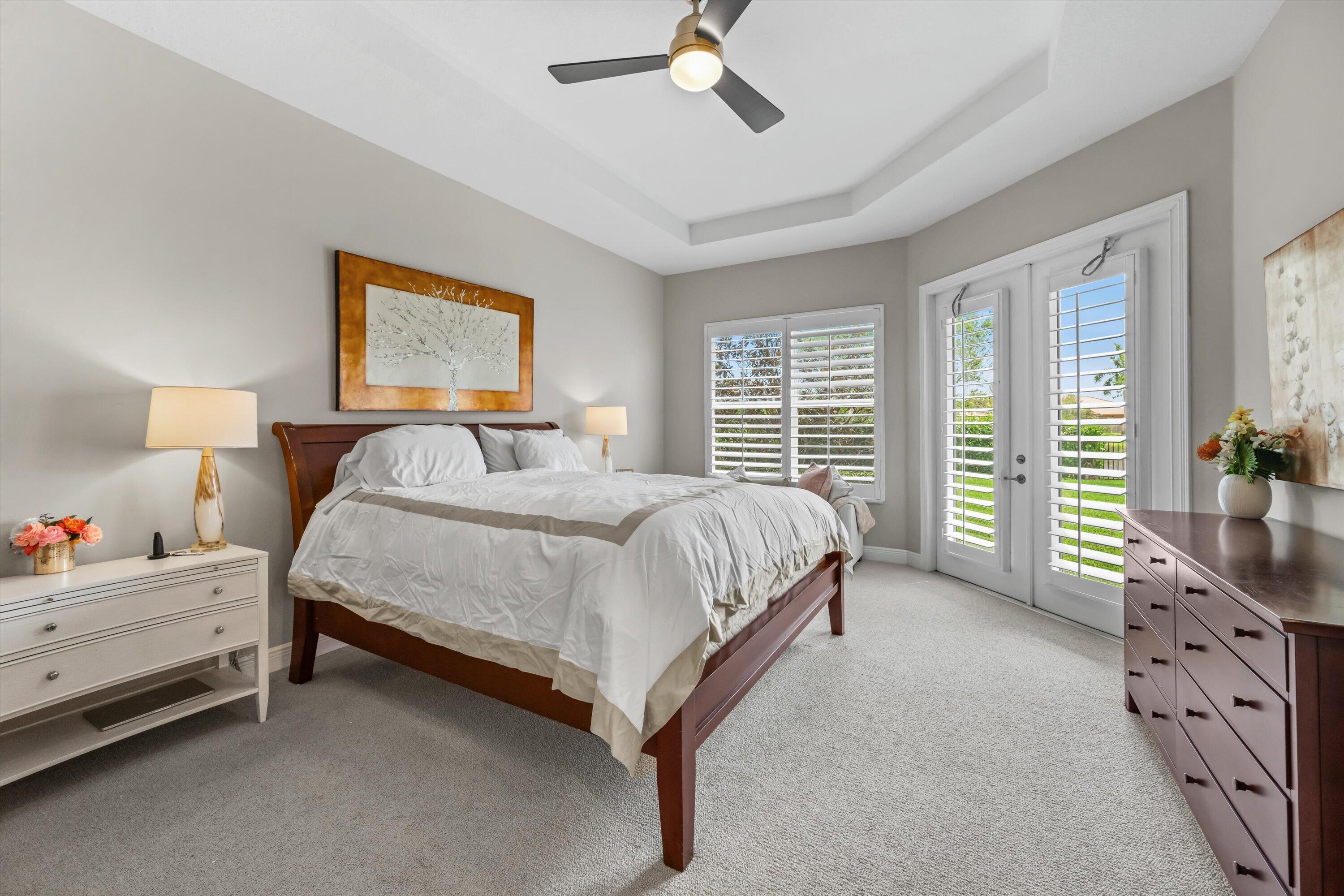 108 Casa Circle Jupiter, FL 33458 - Photo 19 of 53 a bedroom with a bed and a window