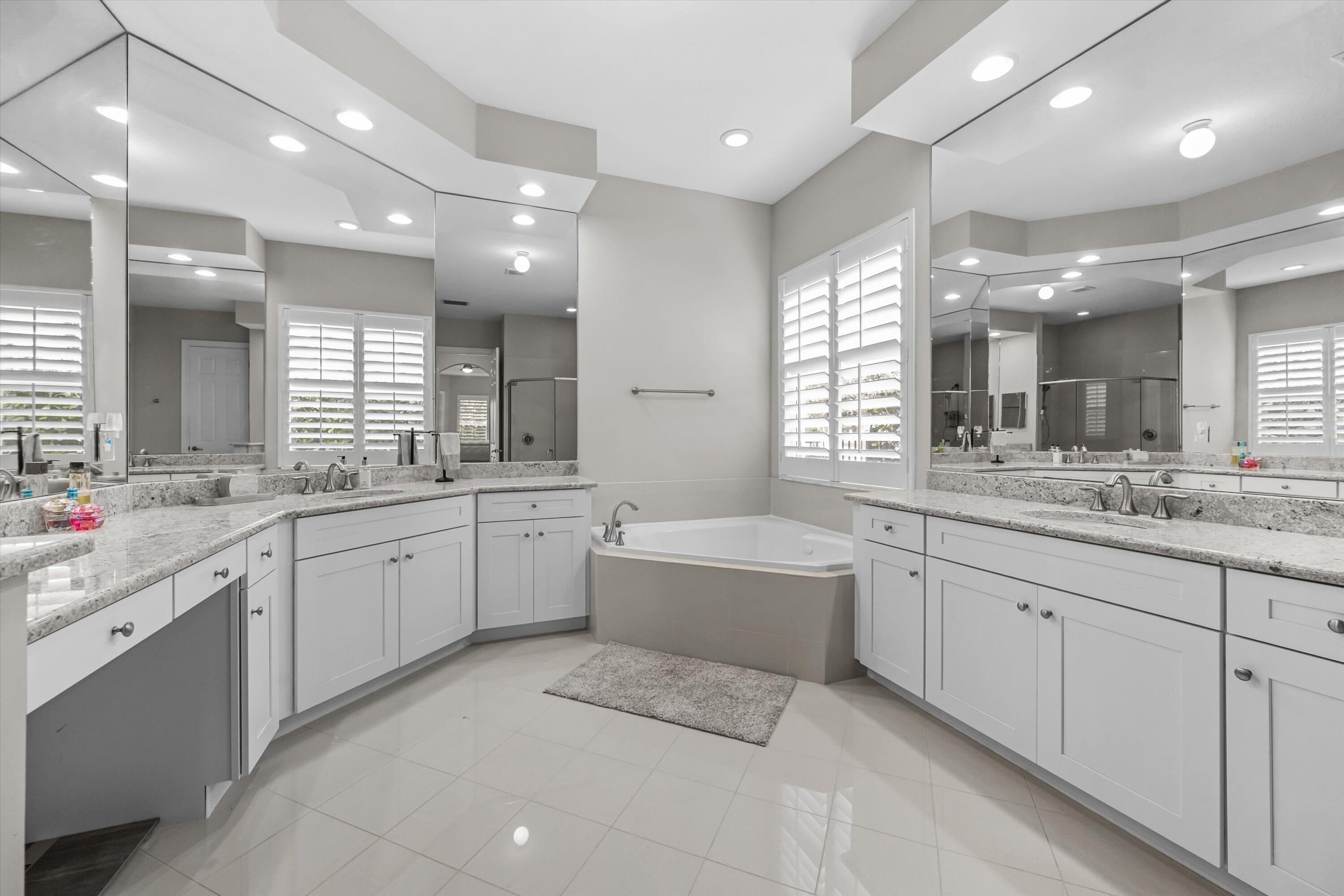 108 Casa Circle Jupiter, FL 33458 - Photo 21 of 53 a large bathroom with a large tub and sink