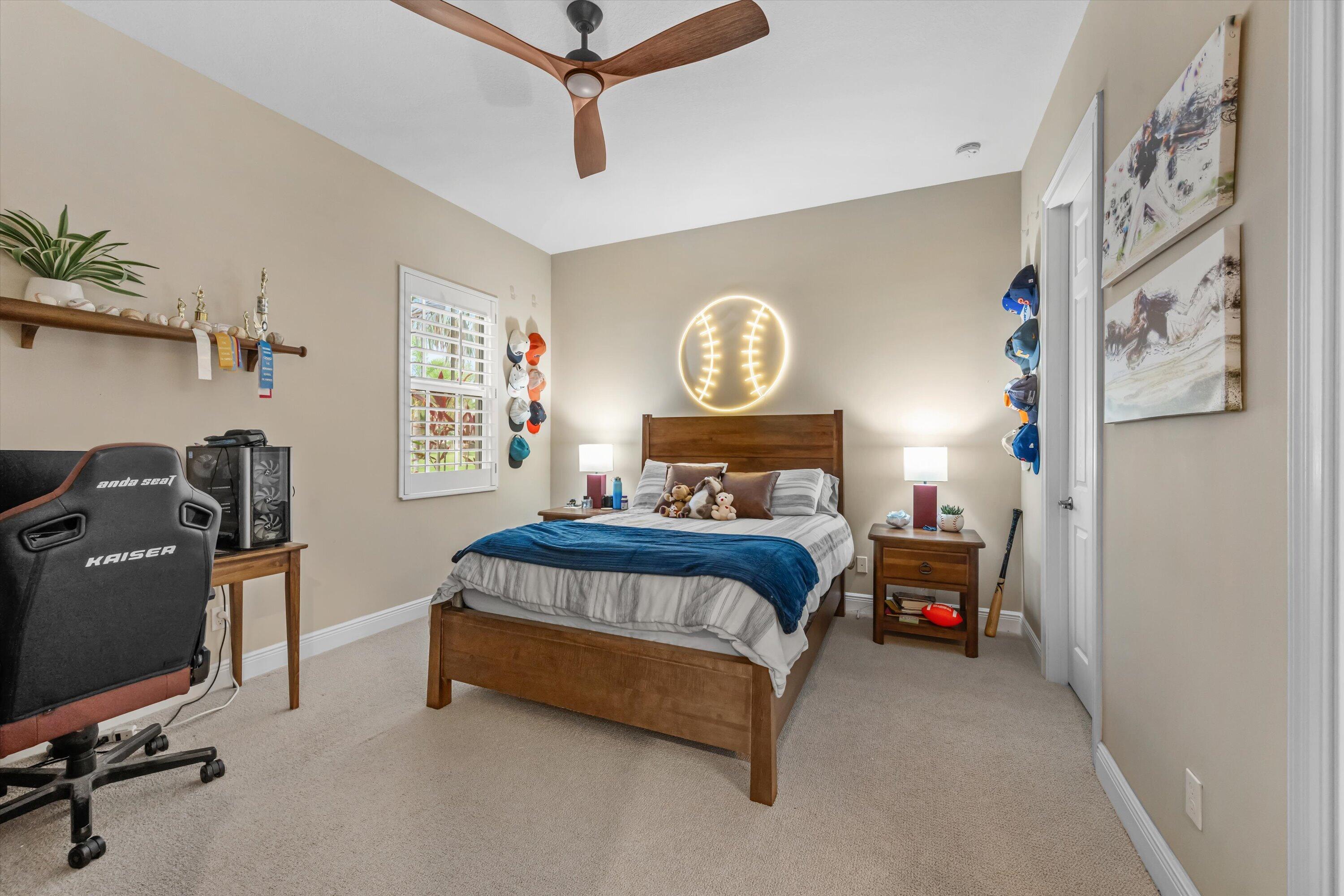 108 Casa Circle Jupiter, FL 33458 - Photo 23 of 53 a bedroom with a bed workspace and a window