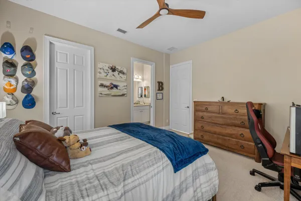 a bedroom with a bed and a dresser