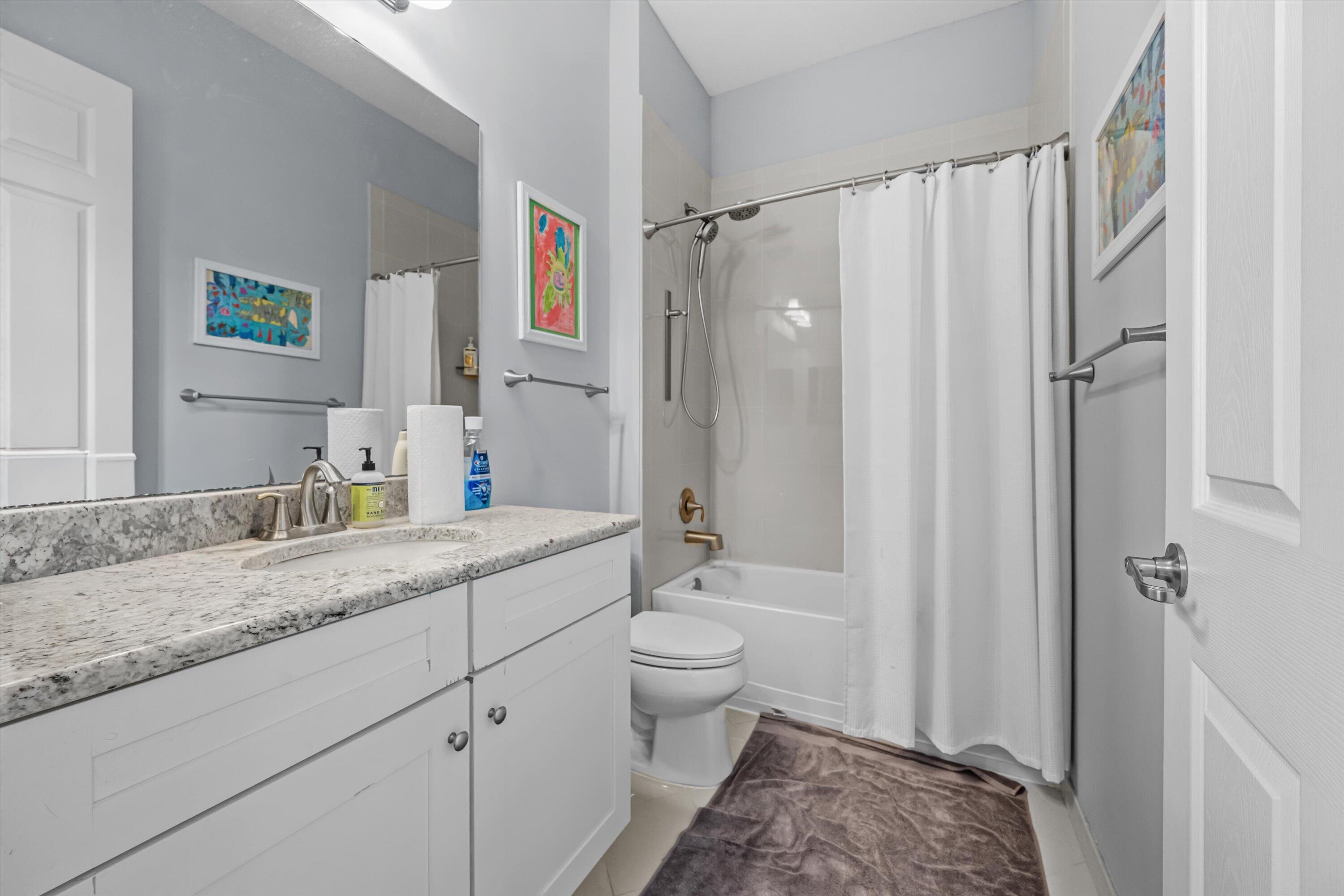 108 Casa Circle Jupiter, FL 33458 - Photo 28 of 53 a en suite bathroom with a granite countertop sink toilet and shower