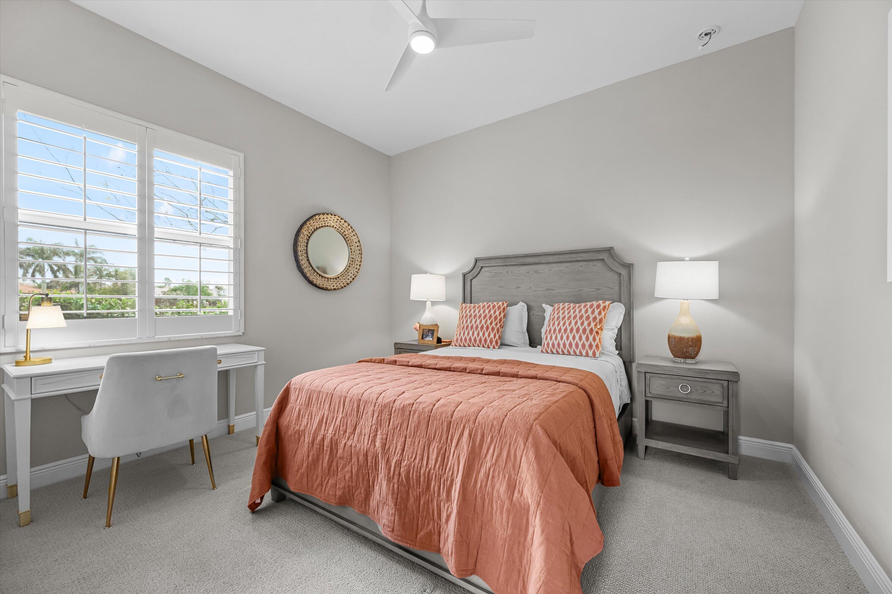 108 Casa Circle Jupiter, FL 33458 - Photo 30 of 53 a bedroom with a bed lamps and windows