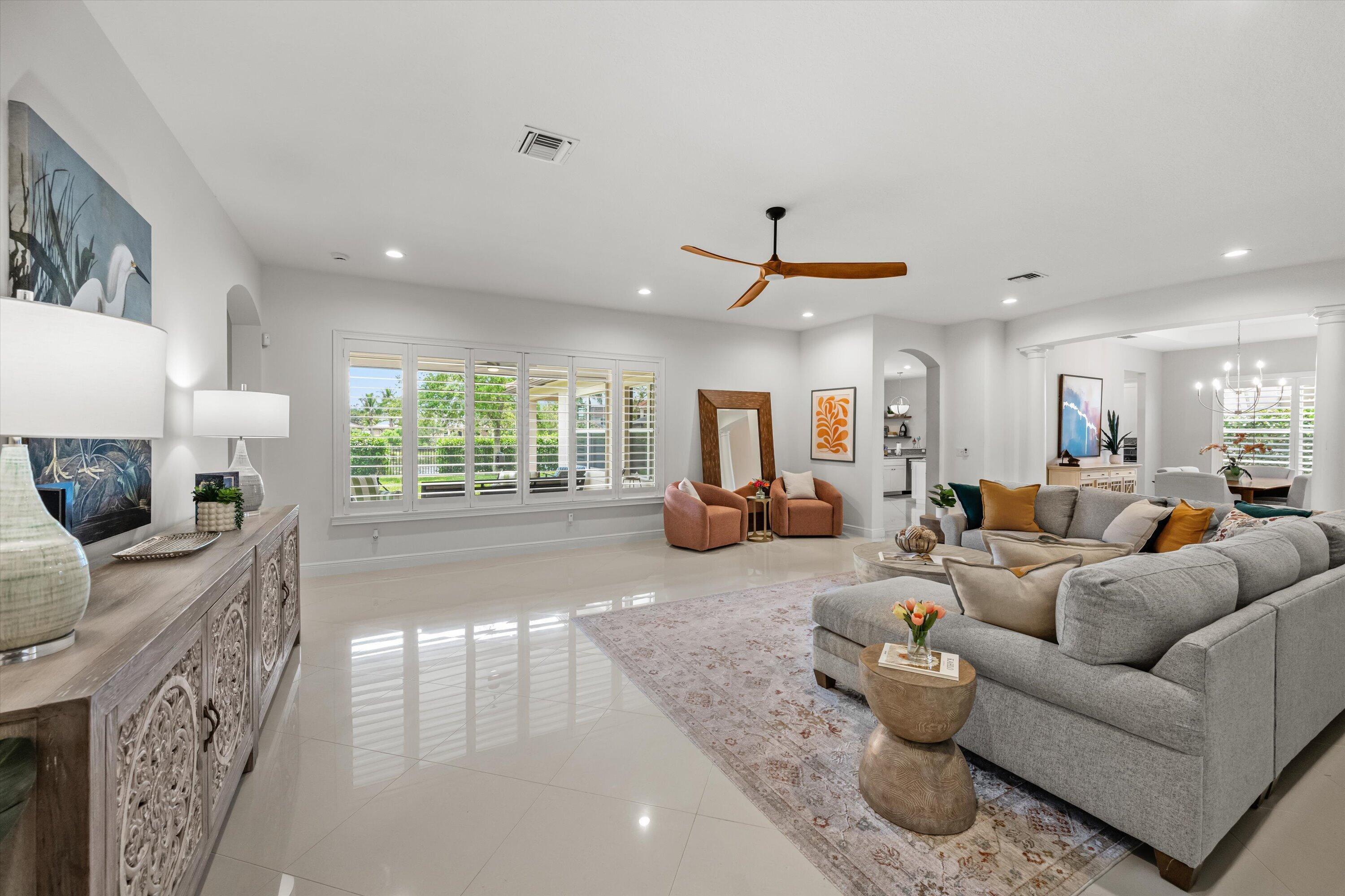 108 Casa Circle Jupiter, FL 33458 - Photo 3 of 53 a living room with furniture and a large window