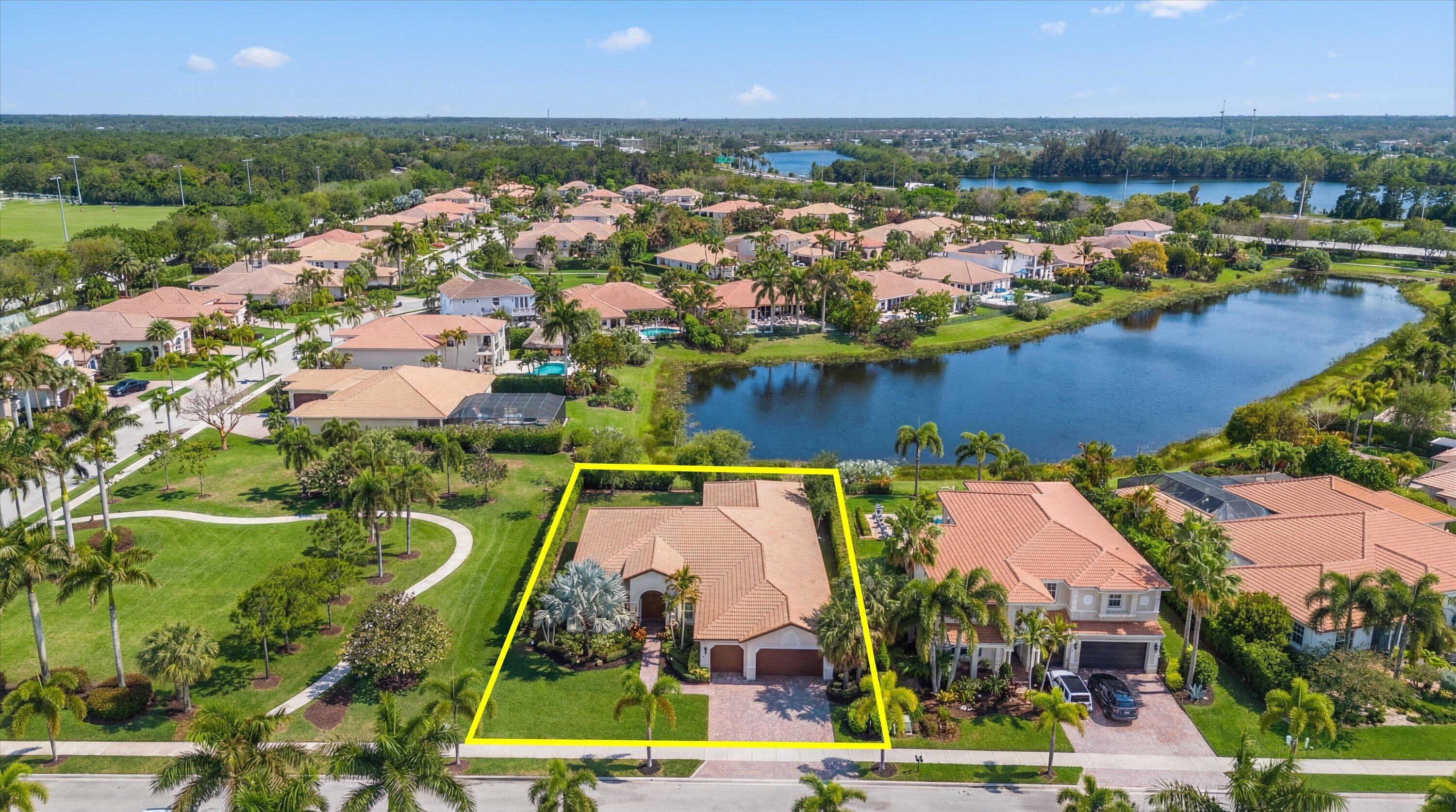 108 Casa Circle Jupiter, FL 33458 - Photo 36 of 53 an aerial view of residential houses with outdoor space and lake view