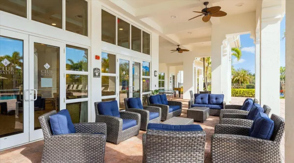 a view of a dining room with furniture water view and wooden floor