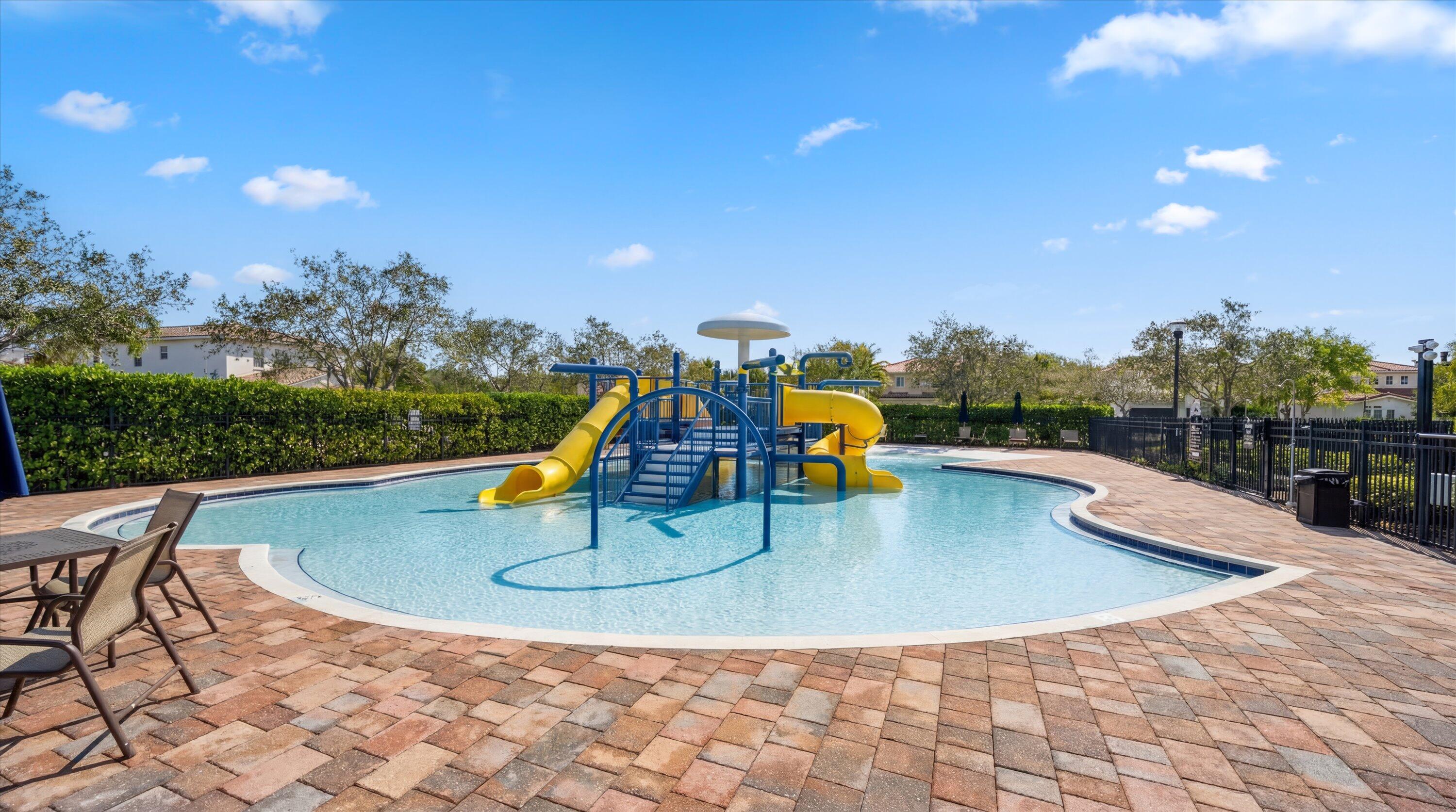 108 Casa Circle Jupiter, FL 33458 - Photo 48 of 53 a view of a swimming pool with a patio