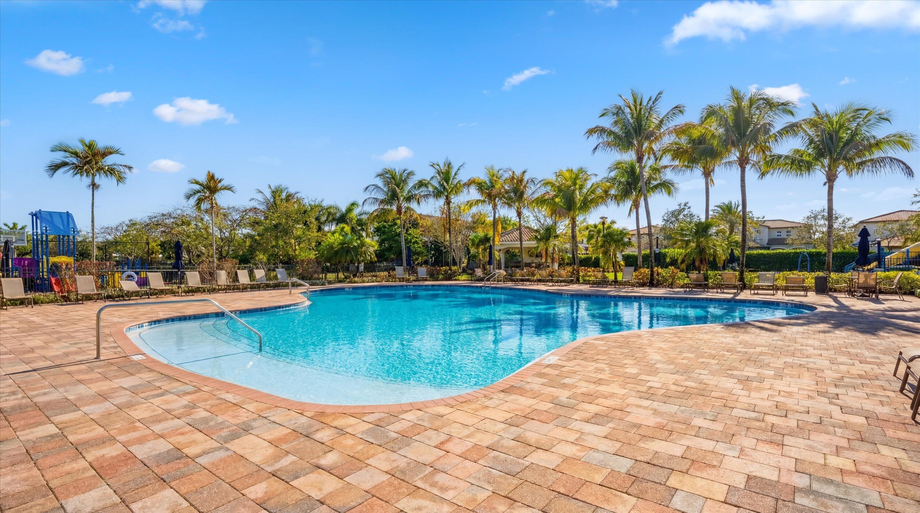 108 Casa Circle Jupiter, FL 33458 - Photo 50 of 53 a view of swimming pool with outdoor seating and palm trees
