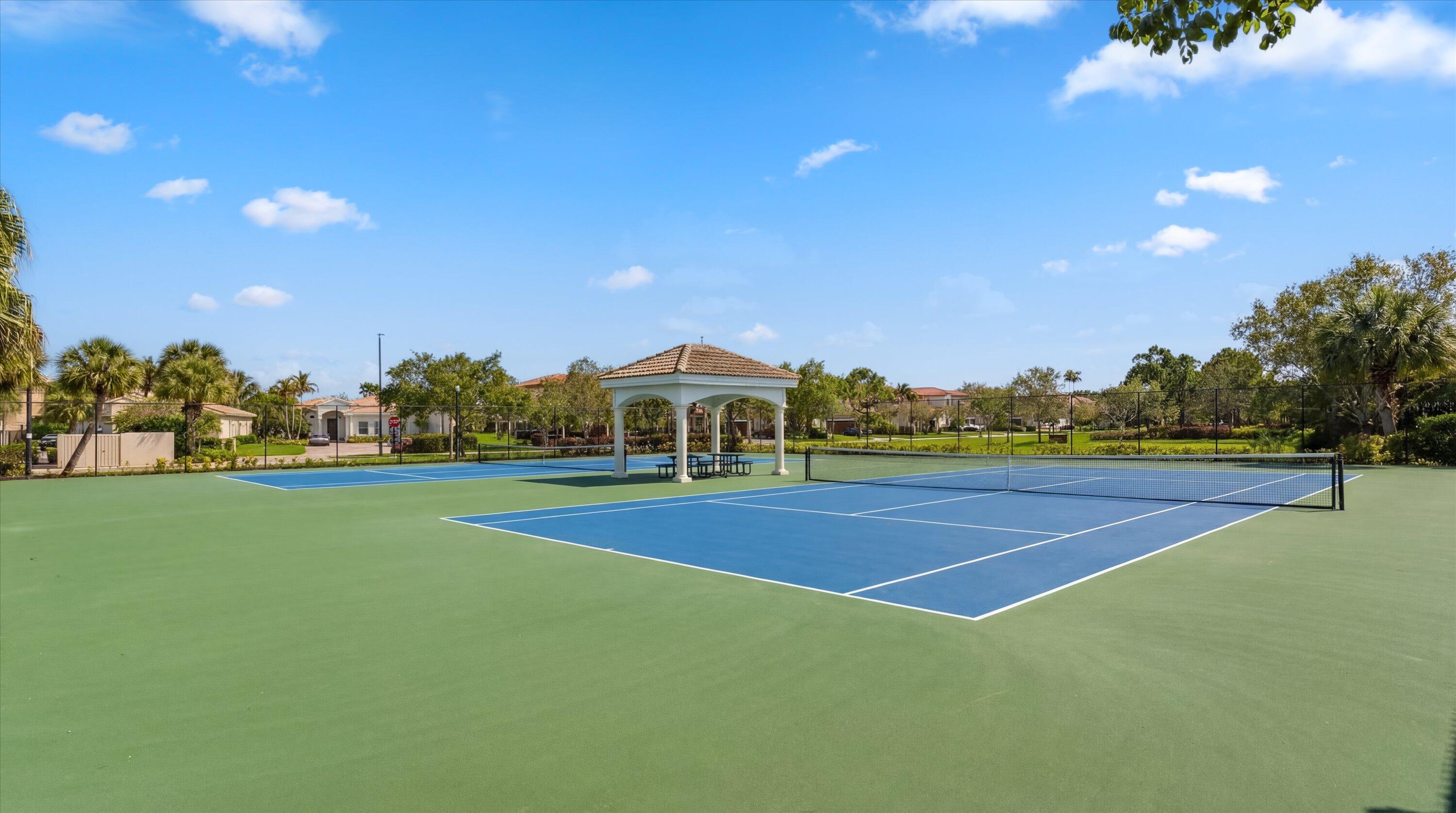 108 Casa Circle Jupiter, FL 33458 - Photo 52 of 53 a view of an outdoor space and tennis court