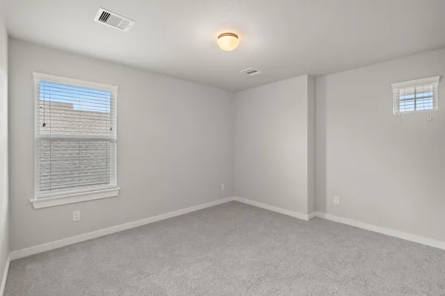 an aerial view of a house with a swimming pool