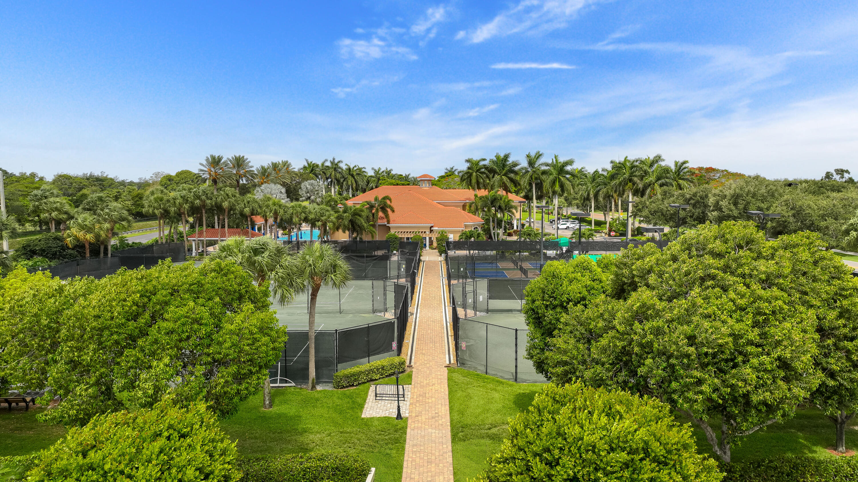 6698 Vía Roma Delray Beach, FL 33446 - Photo 23 of 50 a view of a garden